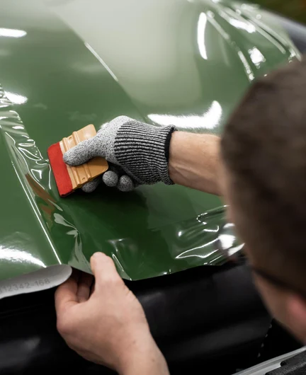 173fa33a-4f18-46dc-816c-49743049488c-person-working-car-wrapping.jpg